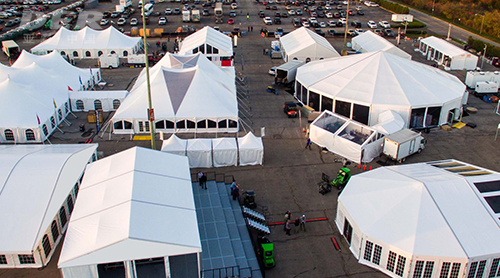 Technical textiles for tents, shelters, and event systems including temporary outdoor structures and warehouse tents