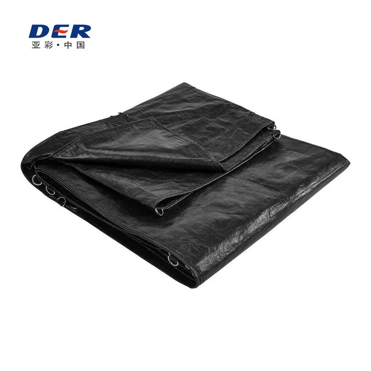 Folded black tarp with metal D-ring attachment points around the reinforced perimeter