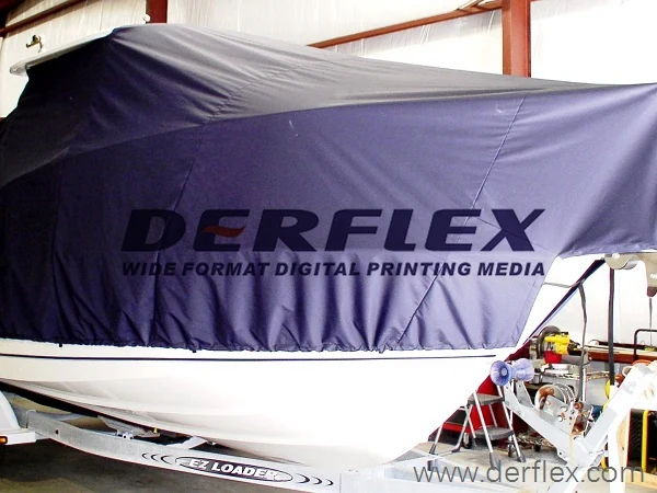 Navy cover over a boat inside a workshop