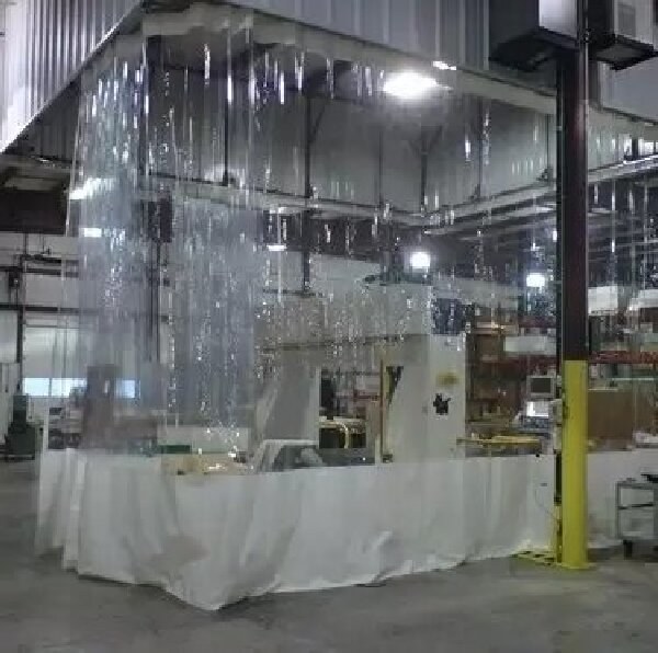 Transparent flexible curtain enclosure around an industrial work area