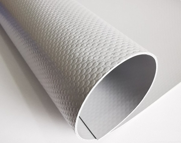 White textured coated fabric curved to show the face and reverse