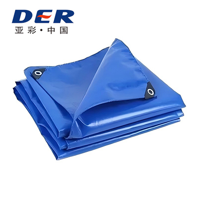 Folded blue DERFLEX tarp with reinforced triangular corners and metal eyelets