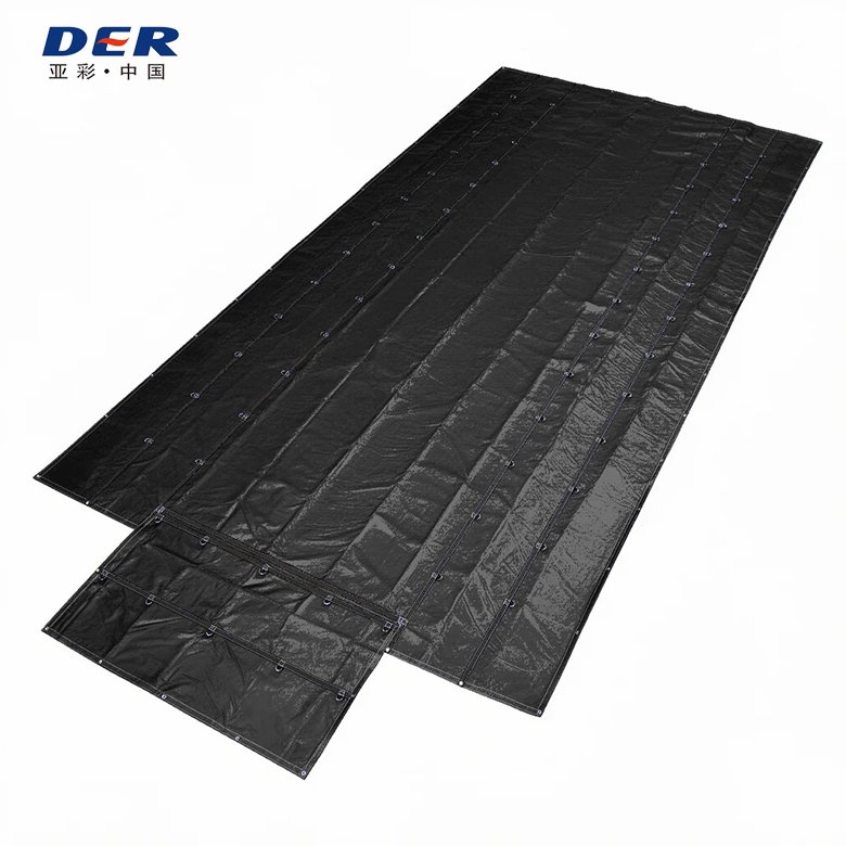 Black flatbed tarp laid flat with several attachment rows and an end flap