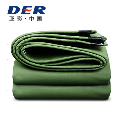 Green PVC tarp folded in layers with a visible rounded fold at the side