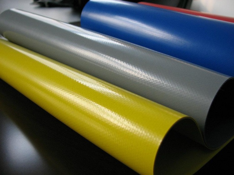 Yellow, grey and blue DERFLEX coated fabric samples with visible surface textures