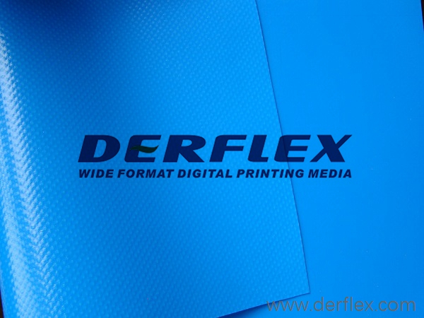 Close-up of blue coated tarp sheets with visible textile surface texture