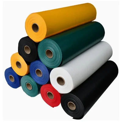Stack of PVC tarpaulin rolls in white, yellow, green, blue, red and black