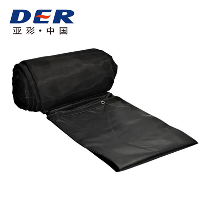 Black DER-branded tarp partly unrolled with metal eyelets along its edge