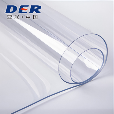 Transparent flexible PVC sheet curled into overlapping loops with blue-tinted edges