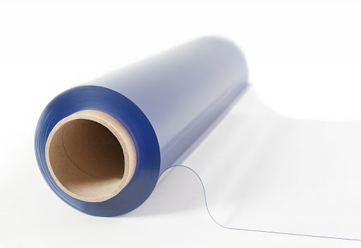 Transparent PVC material wound on a cardboard core with a loose clear edge