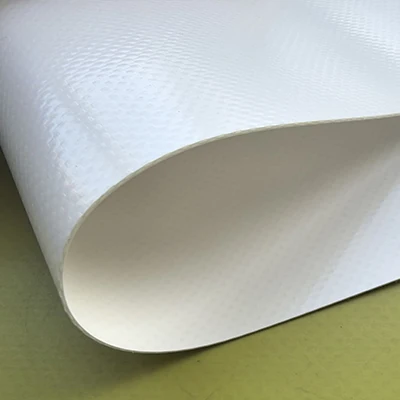 White PVC coated fabric sample with a curved edge and textured surface